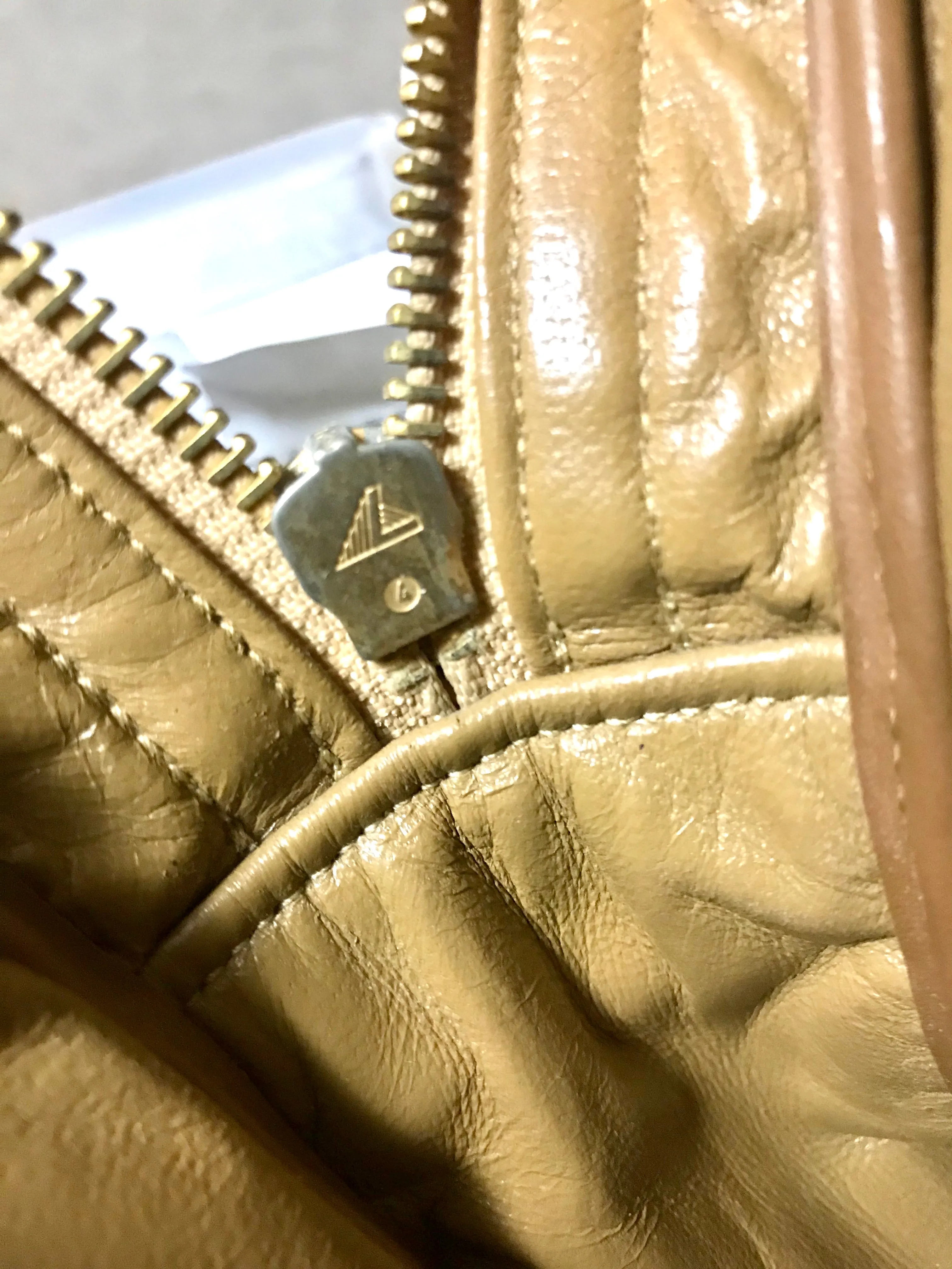 80's Vintage CHANEL brown lambskin large classic bag with double golden chain strap and a CC pull charm.