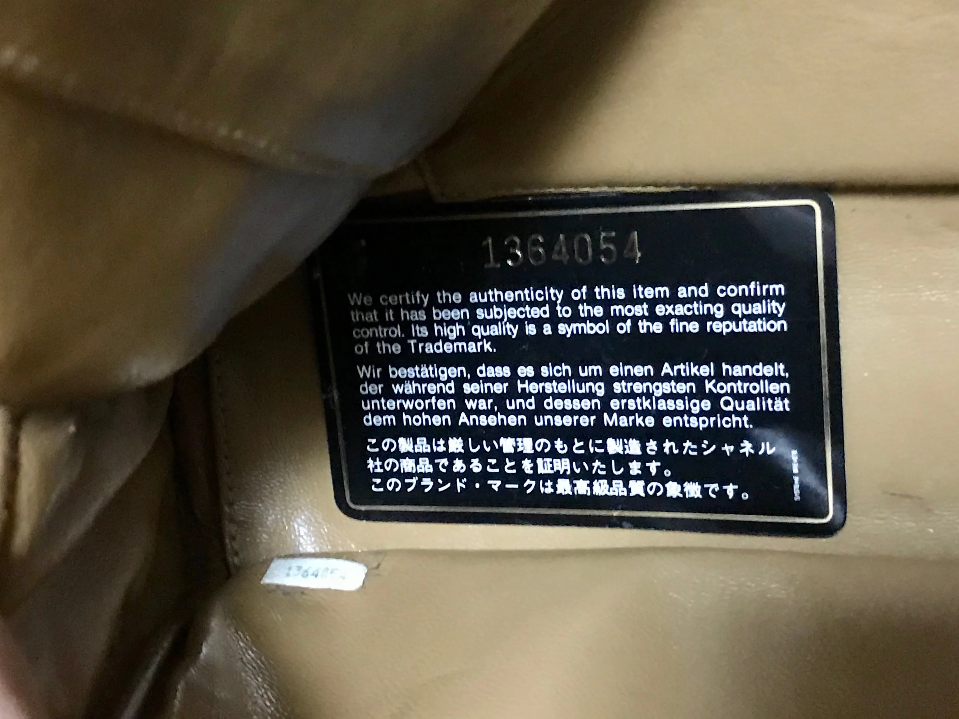 80's Vintage CHANEL brown lambskin large classic bag with double golden chain strap and a CC pull charm.