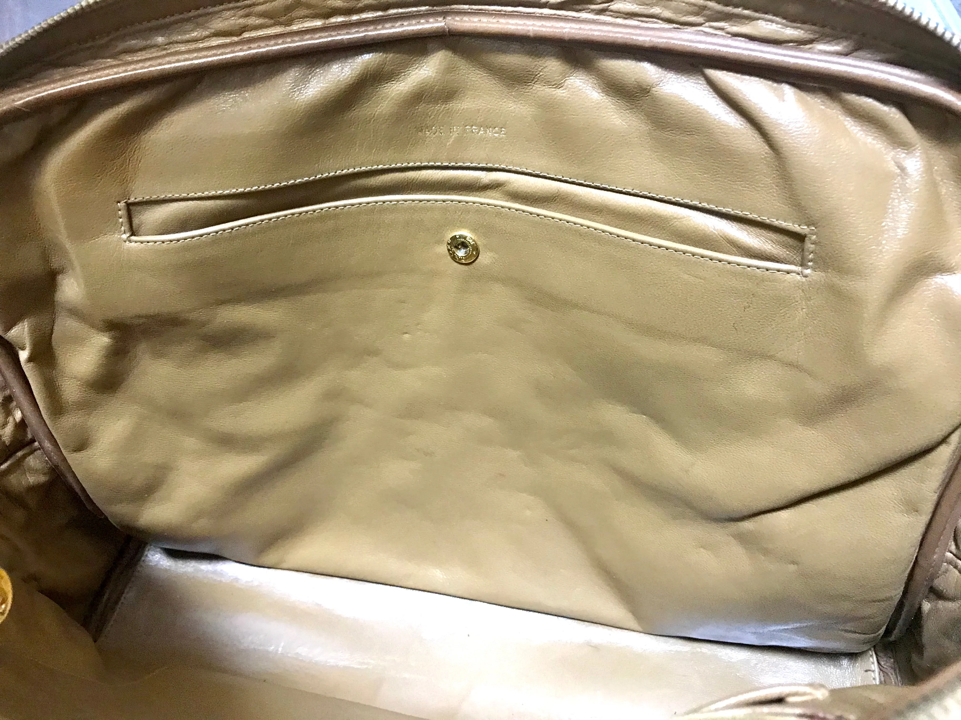 80's Vintage CHANEL brown lambskin large classic bag with double golden chain strap and a CC pull charm.