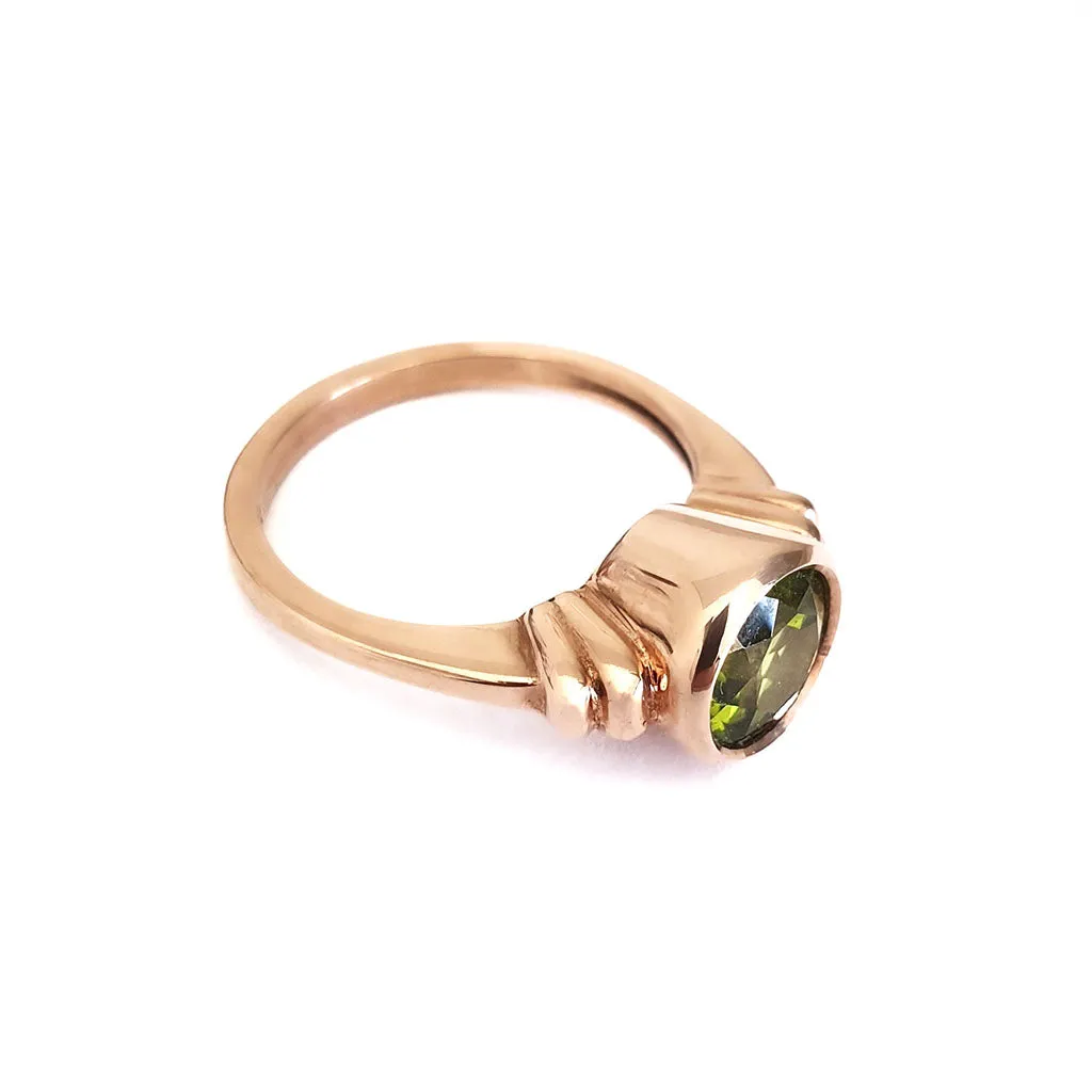 Three Stepped Shoulder Round Bezel Set Rose Gold Peridot Ring