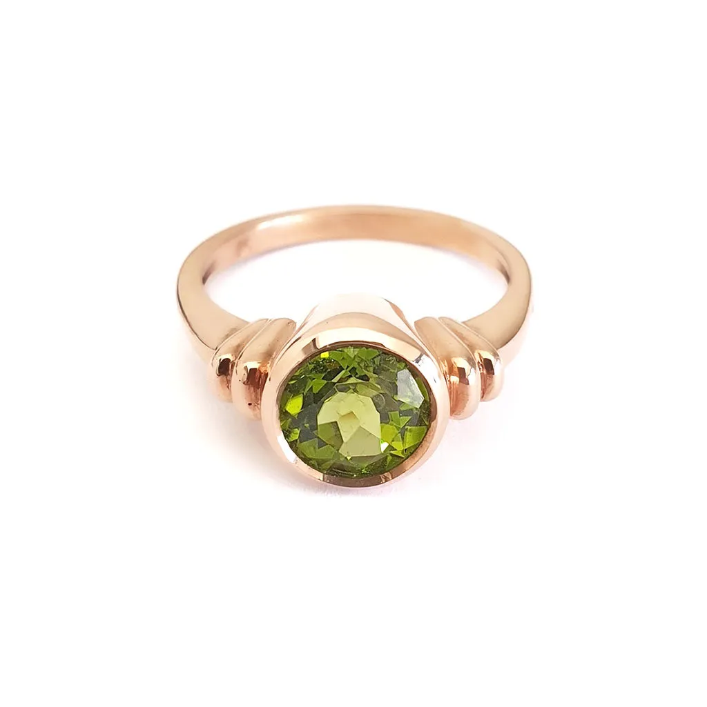 Three Stepped Shoulder Round Bezel Set Rose Gold Peridot Ring