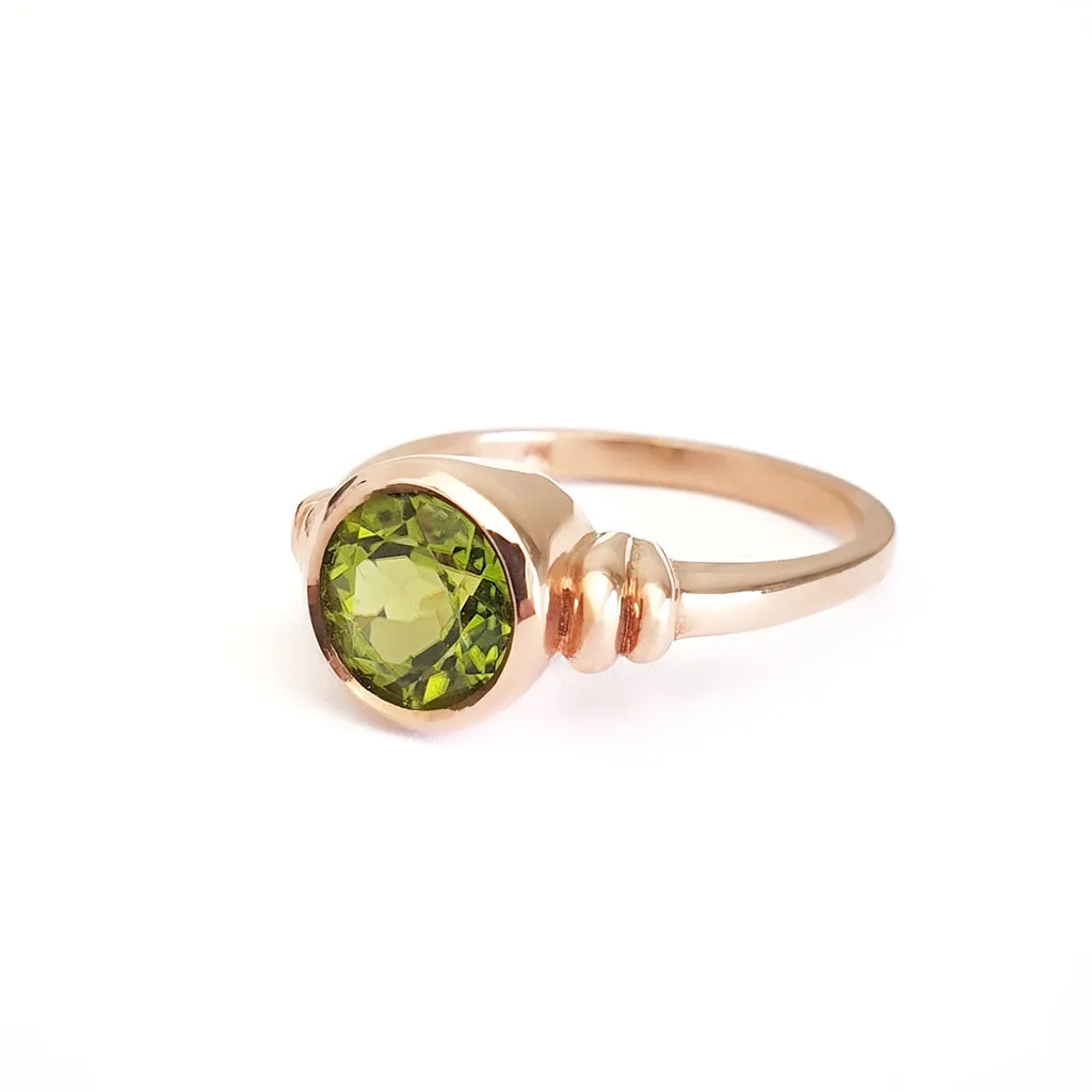 Three Stepped Shoulder Round Bezel Set Rose Gold Peridot Ring